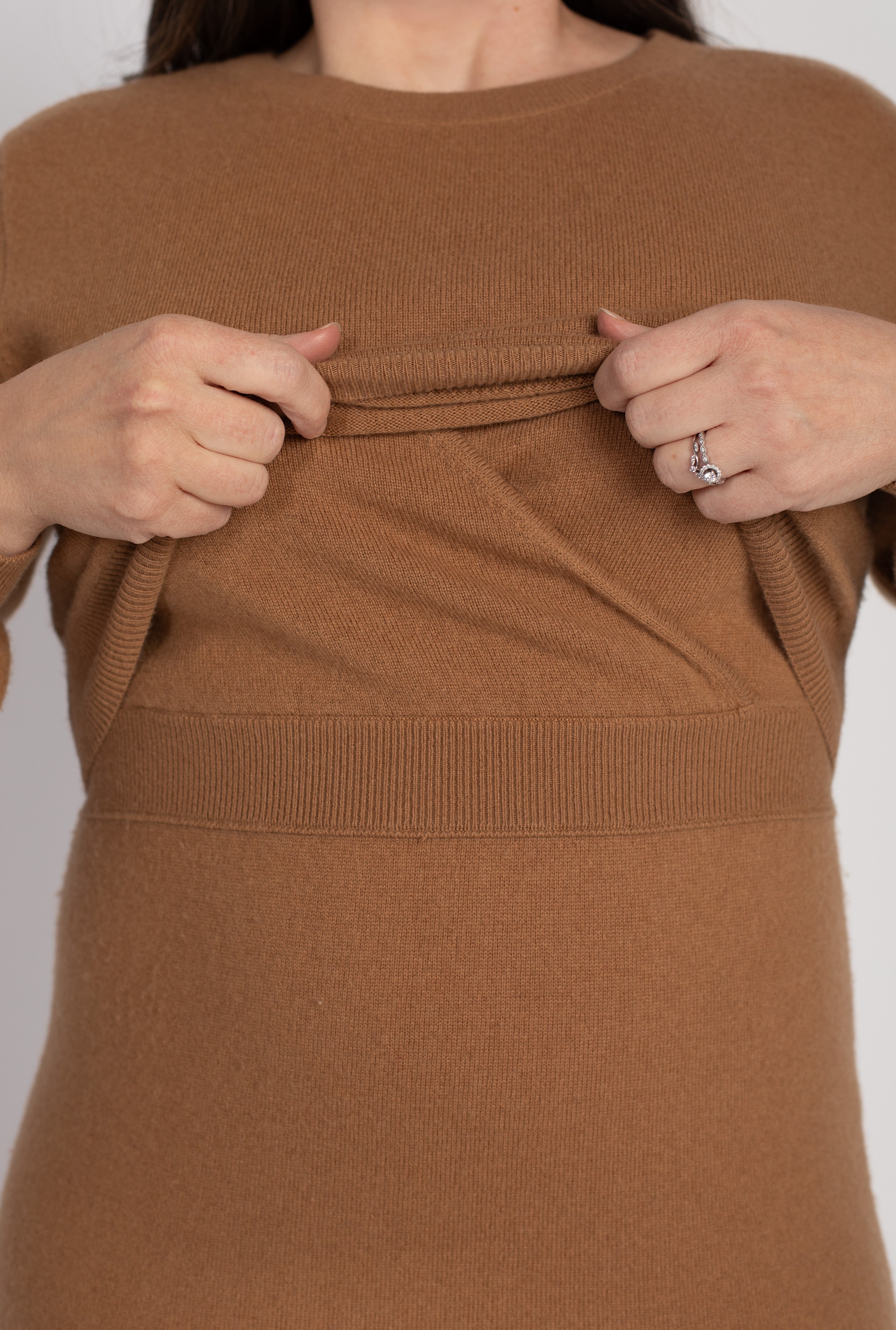 Close-up detail of the Hone Signature Knit Dress in Camel, demonstrating the invisible lift-up nursing access panel for discreet breastfeeding or pumping.